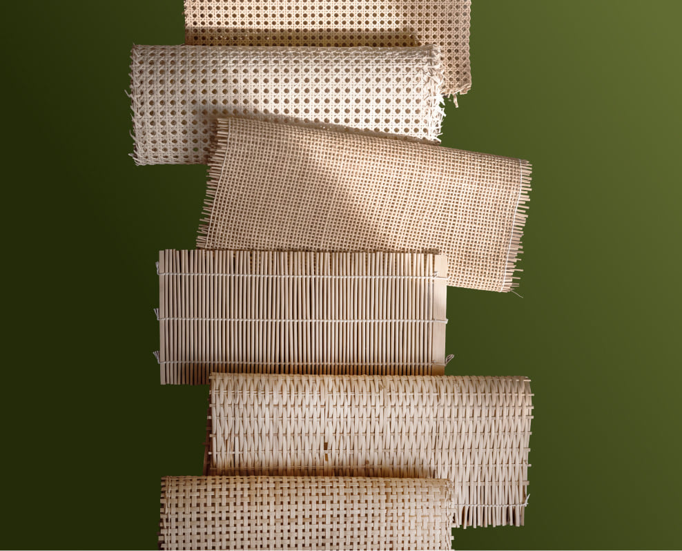 Stack of rattan and woven bamboo textile rolls