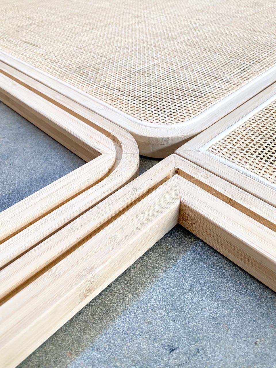 Engineered bamboo frames with open rattan cane webbing, ready for assembly